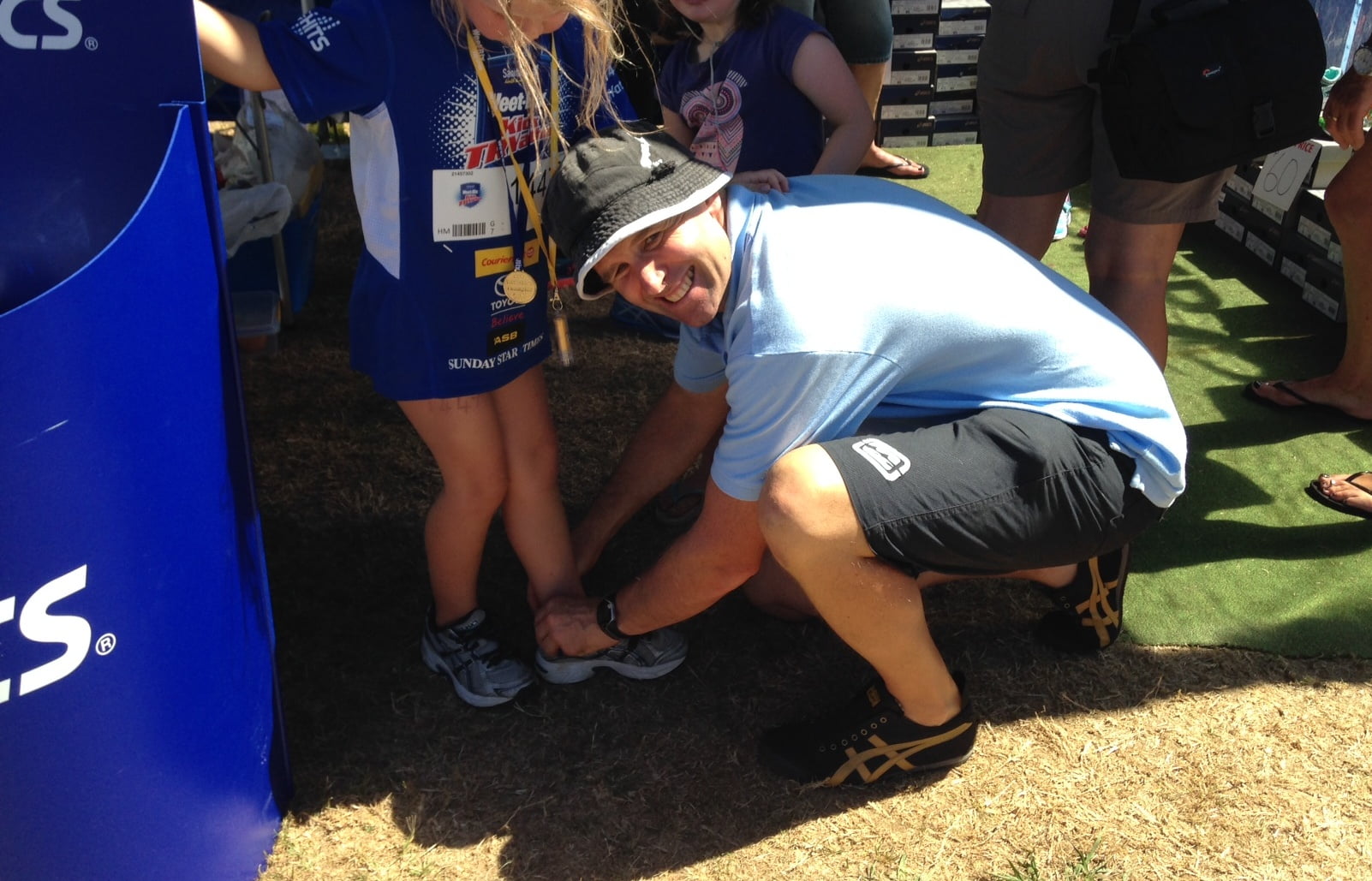 Andrew Jones, Podiatrist adjusting a child's footwear