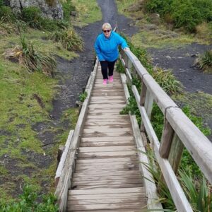 Dot Coveny walking up steps