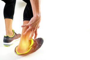 Runner sportsman holding ankle in pain with Broken twisted joint runner sportsman holding ankle
